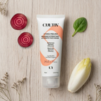 Cultiv face mask tube with beetroot, chicory, and spinach on a wooden surface