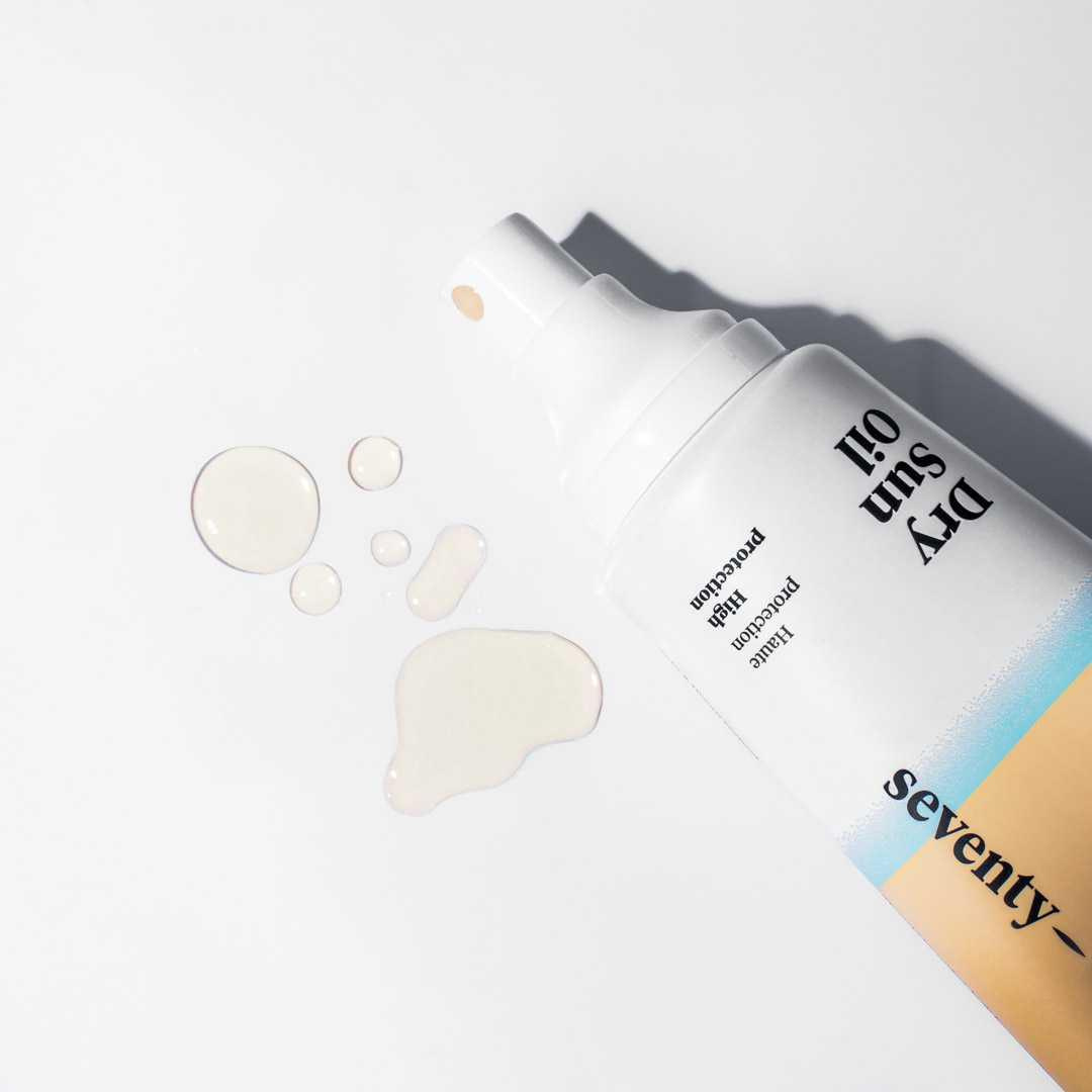 Cosmetic bottle with dropper on a light gray background