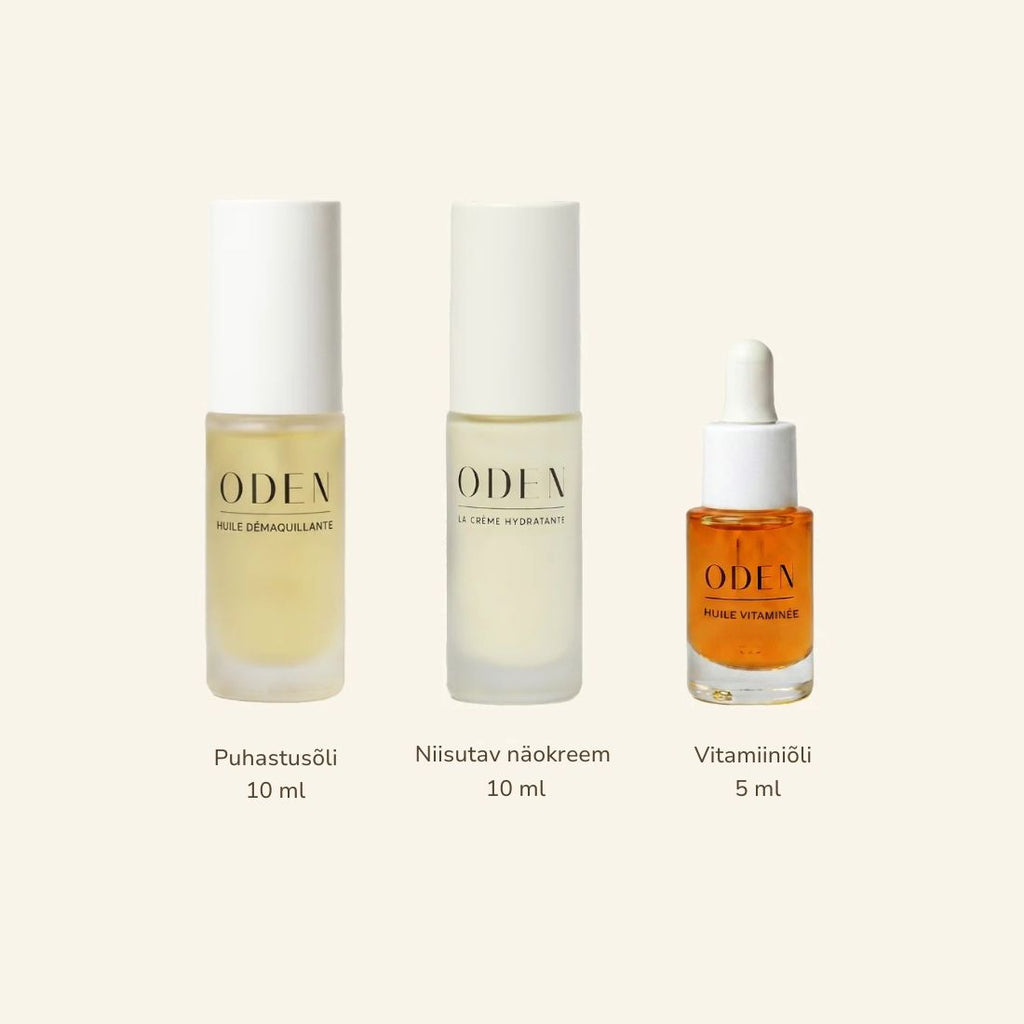 Three ODEN skincare bottles on a light beige background: a 10 ml hydrating cream bottle, a 10 ml face cleansing oil bottle, and a 5 ml vitamin oil dropper bottle. Each bottle has its name and volume printed below.