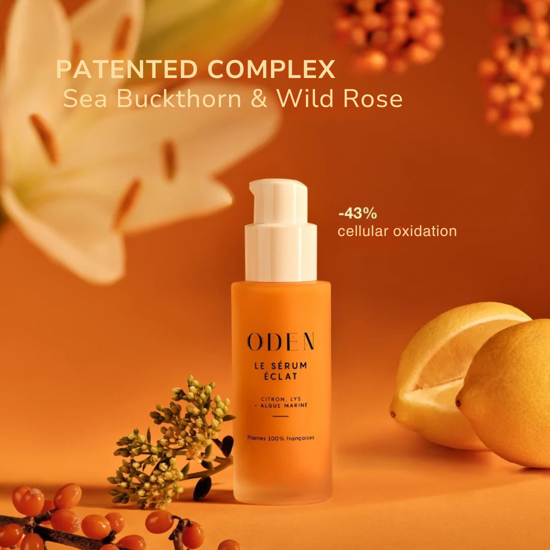 Bottle of ODEN le serum Eclat on orange backround