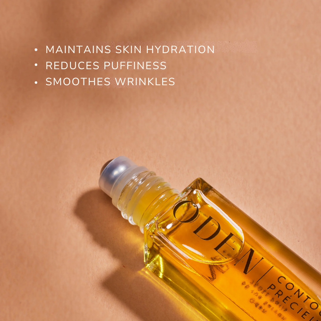 Skincare roller bottle with text on skin hydration benefits on a beige background