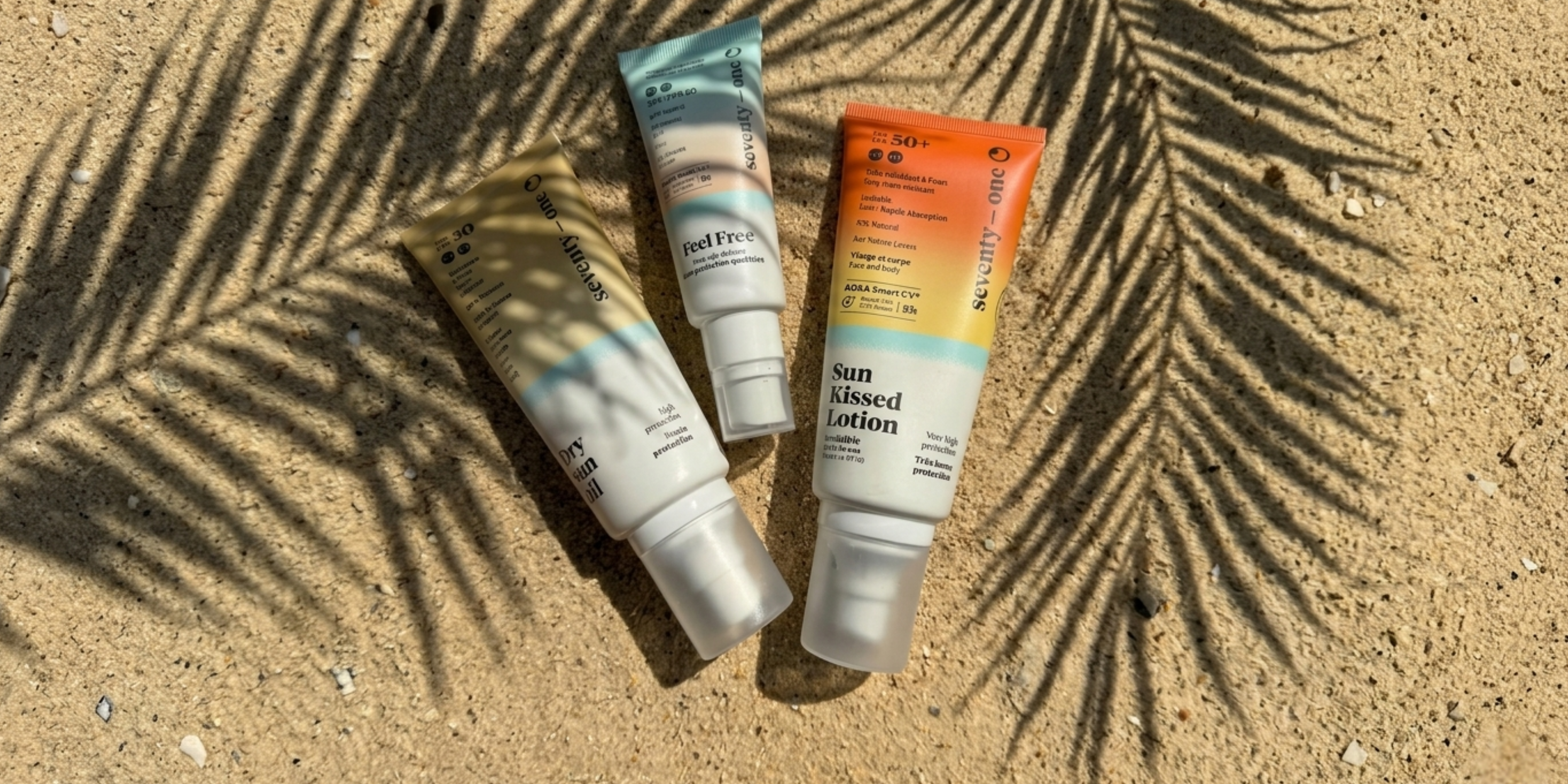 Sunscreen bottles on sand with palm leaf shadow